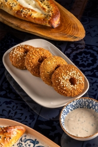Sesame falafel rings with tahini sauce and flatbread at ALATi Mediterranean restaurant, Siam Kempinski.